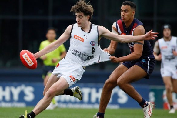 Jonty Faull gets a kick away for the Rebels during a Talent League clash against the Dragons.
