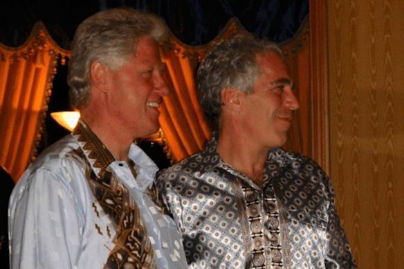 This undated photo released by the U.S. Department of Justice shows former President Bill Clinton and Jeffrey Epstein. (U.S. Department of Justice Department via AP)