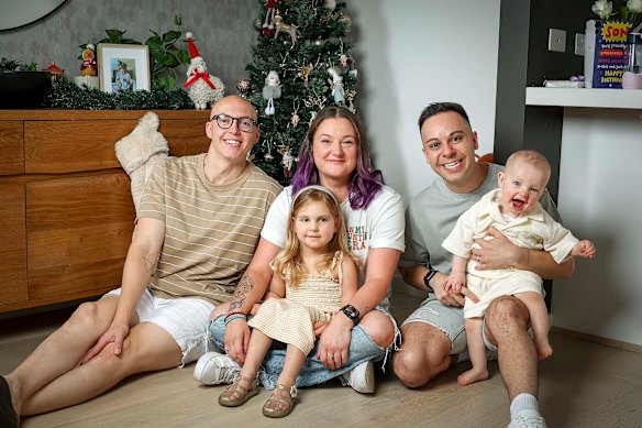 Beth (centre) was a surrogate for Melbourne couple Tyson (left) and Dan, and gave birth to their daughter London and son River.