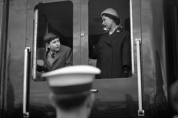 Charles as a boy with Queen Elizabeth as the Royal Train leaves Weymouth in  southern England.