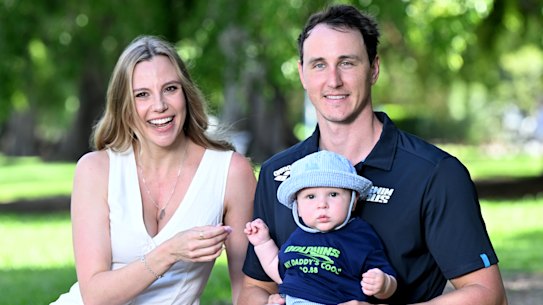 Swimmer Cam McEvoy and his wife Maddi pose for as photo with their baby Hartley in Brisbane on Wednesday.