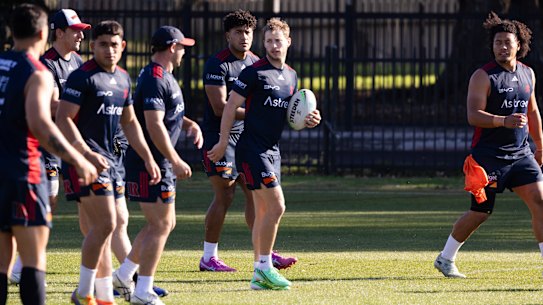 Sam Walker and the Roosters train at Kippax Lake Field on Tuesday.