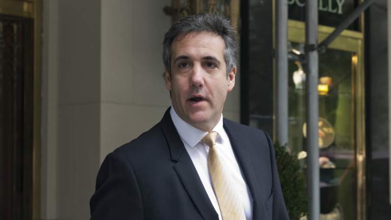 Michael Cohen, former personal lawyer to President Donald Trump, leaves his apartment building in New York on Tuesday.