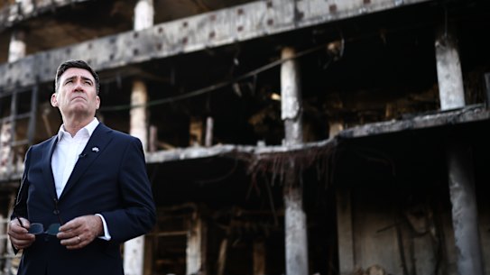 Burnham is shown the rubble at the site of a strike near the Lukanivska market in Kyiv.