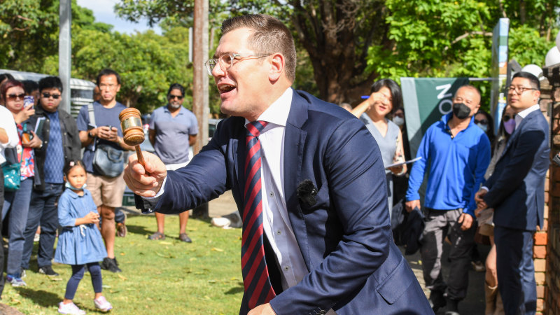 Auctioneer Jesse Davidson prepares to sell the Strathfield home for $4,445,000.