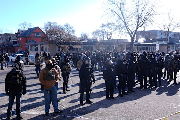 Federal immigration officers deploy near the scene of a shooting Saturday, Jan. 24, 2026.