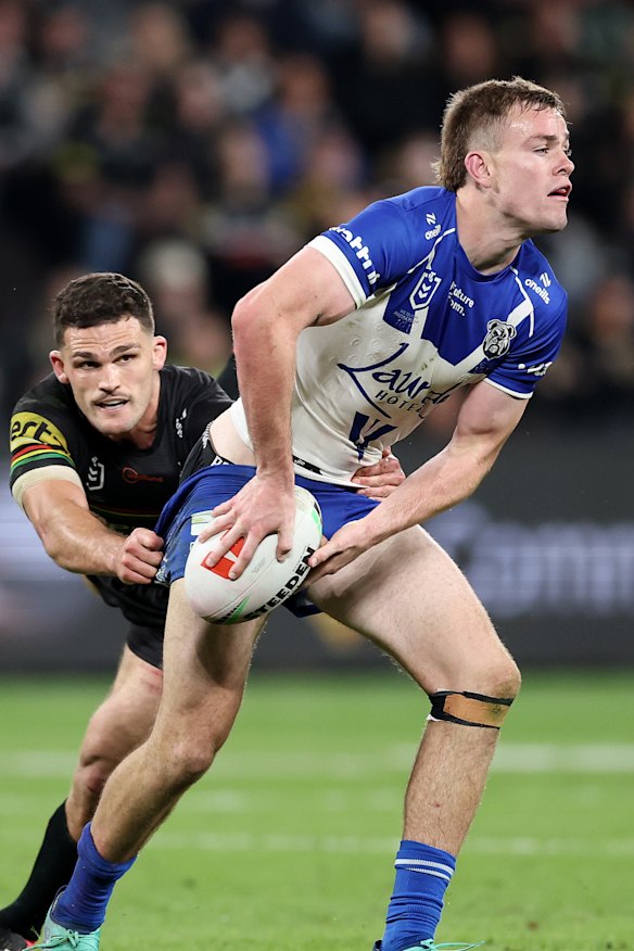 Lachlan Galvin is tackled by Nathan Cleary at CommBank Stadium on Friday night.