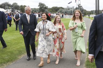 Prime Minister Scott Morrison and Jenny Morrison with their daughters Abbey and Lily during the Australia Day flag raising and citizenship ceremony at Rond Terrace in Canberra.