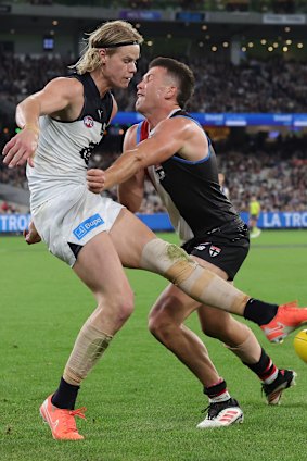 Tom De Koning of the Blues is tackled by Rowan Marshall of the Saints.