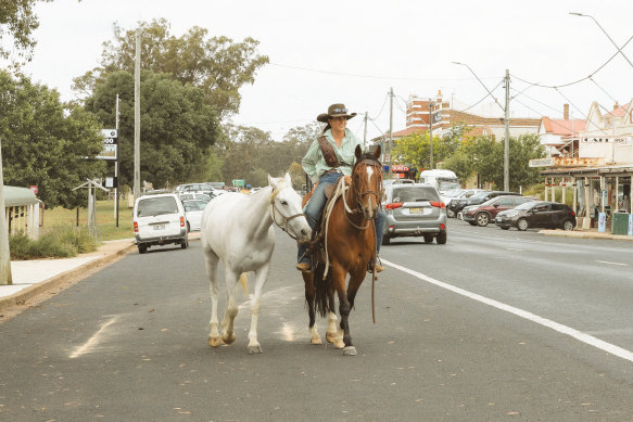 Sarah Wheeler riding through Dunedoo during her 5500-kilometre trek for cancer.