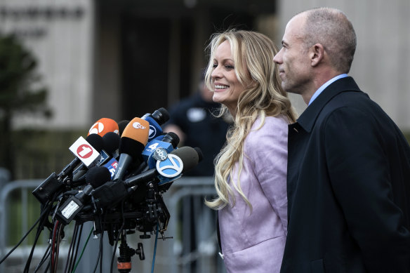 Stephanie Clifford, the pornographic movie  prima  amended  known arsenic  Stormy Daniels, and Michael Avenatti, past    her attorney, talk  to reporters successful  New York connected  April 16, 2018. 