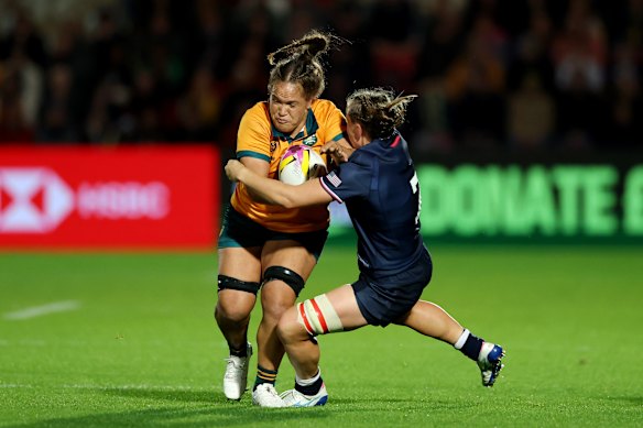 Australia’s Ashley Marsters takes the ball up during the match.