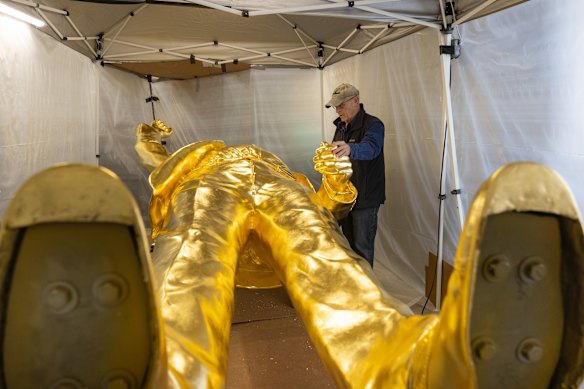 Designer Alan Cottrill inspects the 4.5-metre statue.