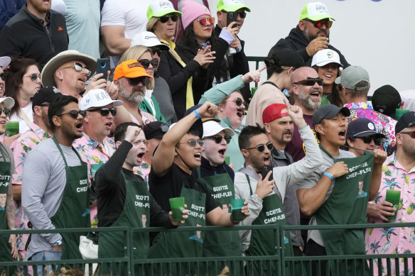 Fans of Scottie Scheffler cheer him on at the 16th hole.