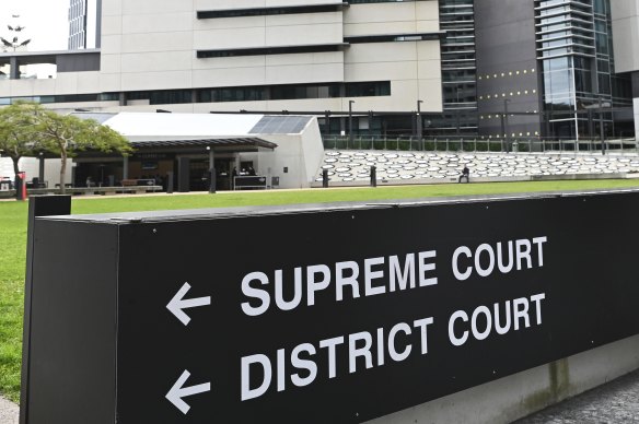 A man has been charged with allegedly attacking a convicted murderer who was appearing in court for sentencing.
