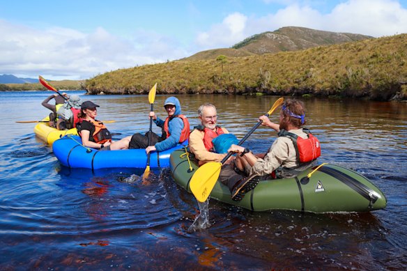 Becca Lunnon and her climbing crew crossing Bathurst Harbour to approach Mount Rugby.