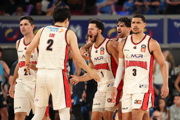 Tyler Harvey of the Hawks celebrates a three-pointer.