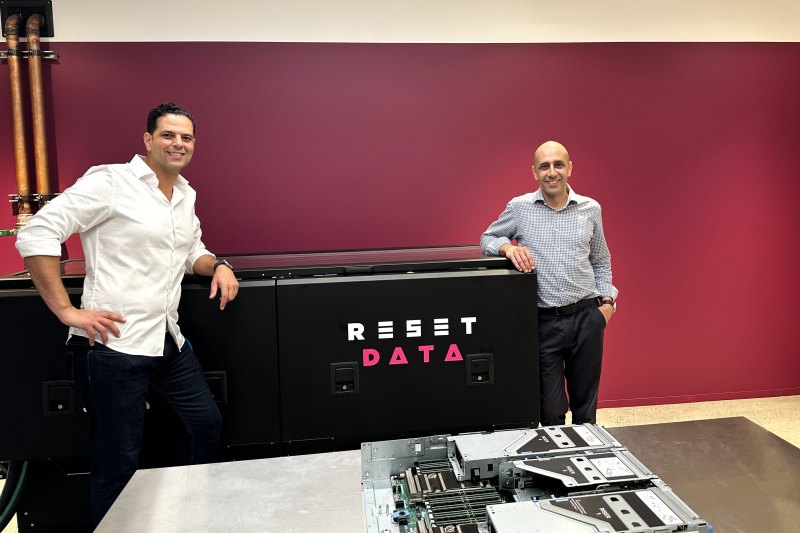 ResetData co-founders Bass Salah (right) and Marcel Zalloua with a liquid-cooled cloud server in the basement of Investa’s building at 151 Clarence Street, Sydney.