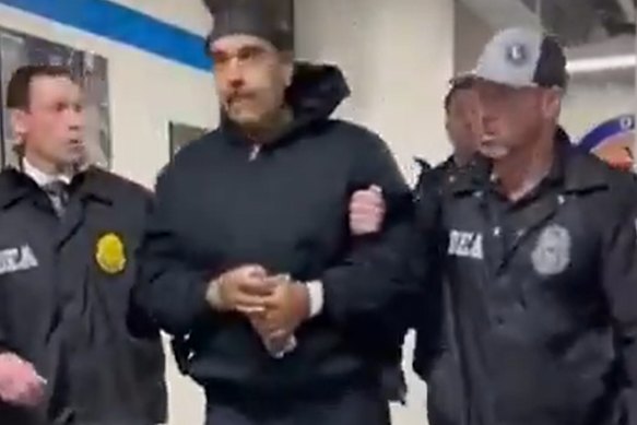 Nicolas Maduro being &ldquo;perp walked&rdquo; by Drug Enforcement Administration officers in New York.