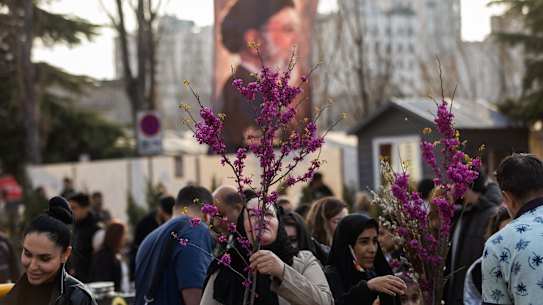 People shop for flowers at a market ahead of Nowruz celebrations on March 19, 2026 in Tehran, Iran. Nowruz, or Persian New Year, is a festival celebrated worldwide by various ethnicities. It takes place on the spring equinox, according to the Iranian Solar Hijri calendar. This year the holiday falls three weeks into the war that broke out on February 28 with US-Israeli joint attacks on Iran, which killed Supreme Leader Ayatollah Ali Khamenei. Iran has retaliated by firing waves of missiles and drones at Israel, and targeting US allies in the region.