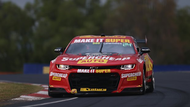Craig Lowndes puts the foot down during a practice session at Mt Panorama.