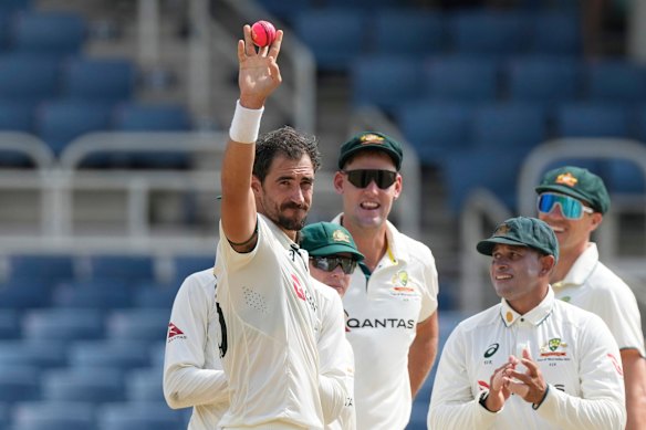 Mitchell Starc celebrates his five-wicket haul.