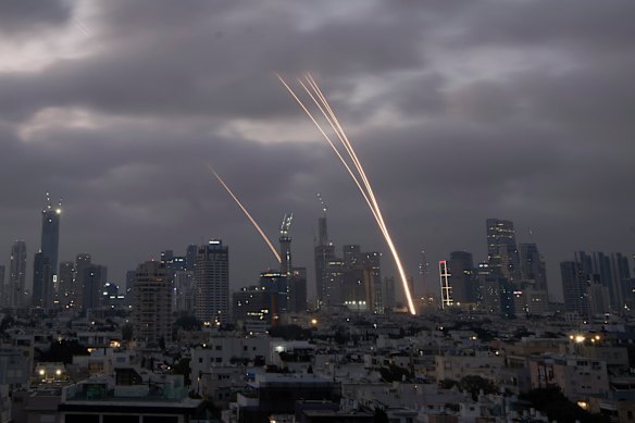 Israel’s Iron Dome air defence system fires to intercept projectiles over Tel Aviv on Saturday. Iran struck back after Israel launched its surprise attack a day earlier.