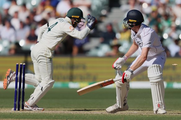 England’s Zak Crawley reacts after he was out stumped by Australia’s Alex Carey, left, during play on day four in Adelaide.