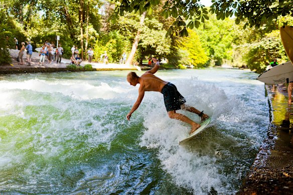 Surf’s up on the man-made canal  in Englischer Garten, Munich. 