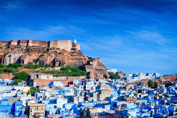 A view over Jodhpur, India, also known as the Blue City, looking towards the massive 15th-century Mehrangarh Fort.