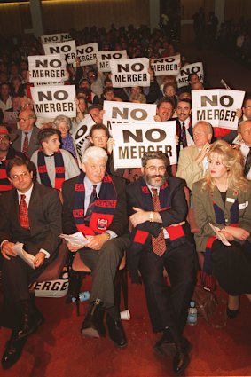 Melbourne supporters at an anti-merger meeting. Brian Dixon and Joseph Gutnick (right) are pictured at the front.

