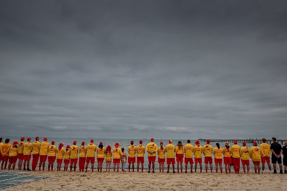 Altona Life Saving Club lifesavers stood with emergency service officers to pay tribute to the Bondi victims.