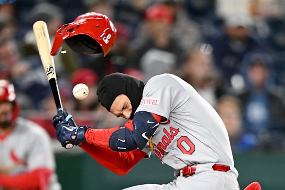Masyn Winn #0 of the St. Louis Cardinals is hit by a pitch in the sixth inning against the Washington Nationals at Nationals Park on April 07, 2026 in Washington, DC. 