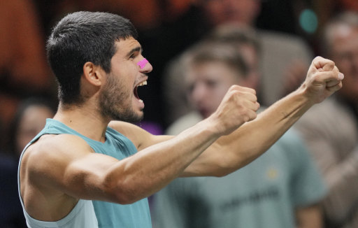 Four-time grand slam champion Alcaraz celebrates his Rotterdam title win.