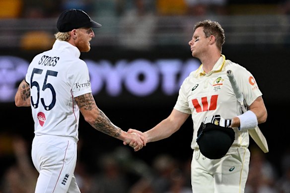 Steve Smith and Ben Stokes shake hands at the end of the second Ashes Test at the Gabba.