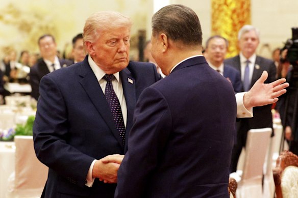 Donald Trump shakes hands with Xi Jinping during a state banquet at the Great Hall of the People on Thursday.