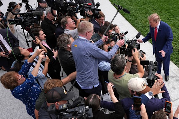 Trump speaks to reporters on the South Lawn before departing for a rally in Georgia.