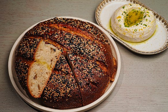 House-baked sesame sourdough with tarama and eggplant dip.