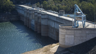 Warragamba Dam, now sitting at about 50 per cent full. The government says lifting the wall by 14m would reduce downstream flood damage.