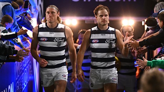 Mark Blicavs and Jake Kolodjashnij leading the Cats out in Geelong in round six against the Bulldogs.