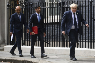 Britain’s Chancellor of the Exchequer Rishi Sunak (centre) has resigned, along with Health Secretary Sajid Javid (left), throwing Boris Johnson’s leadership into turmoil.