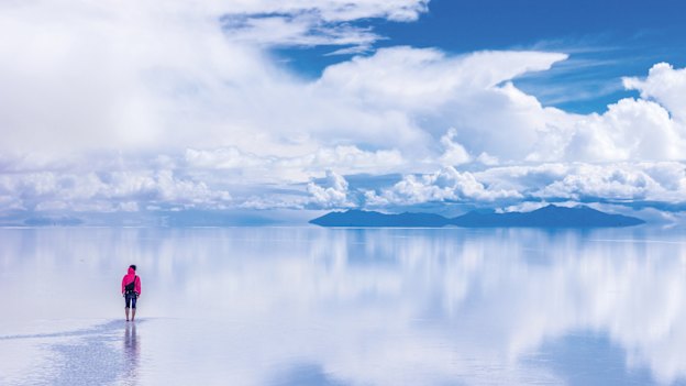 During the wet months, a thin sheet of water covers Bolivia’s vast salt flats, creating wondrous mirror-like reflections.