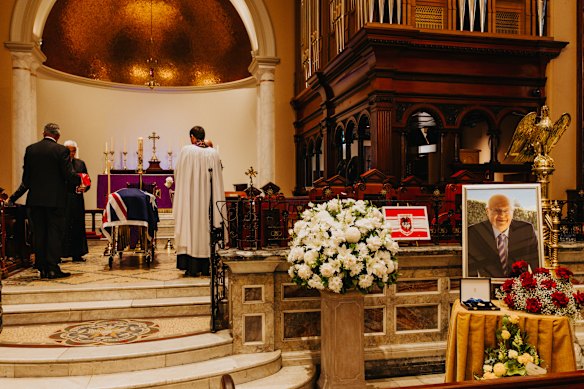 Graham Richardson’s coffin arrives at St James’ Church.