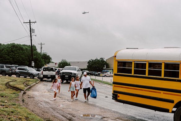 Children arrive at a reunification centre in Ingram on Friday.