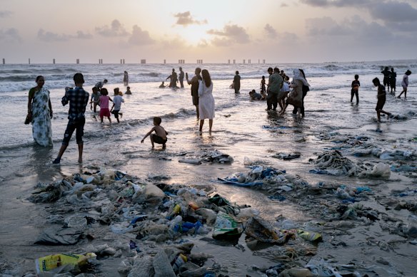 Plastic waste covers the shore in Mumbai, India.