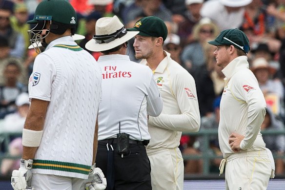 Cameron Bancroft talks to the umpires as he is sprung with sandpaper in Cape Town.