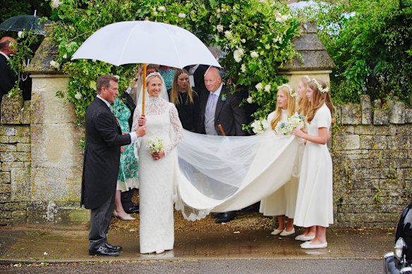 The married couple prepare to depart after their wedding ceremony.