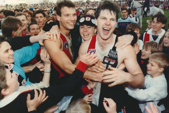 St Kilda teammates and friends Stewart Loewe (left) and Danny Frawley after beating Fitzroy by one point at Moorabbin in 1990.