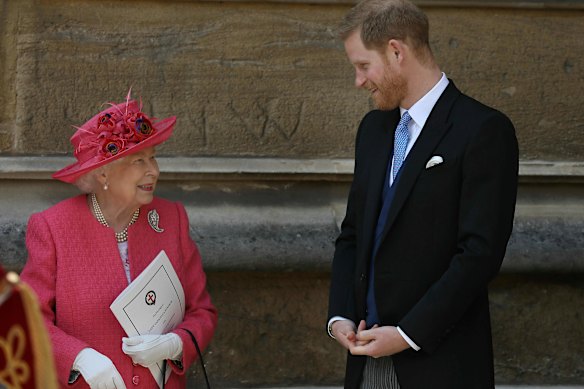 The Queen and Prince Harry share a happy moment after the wedding of Lady Gabriella Windsor and Thomas Kingston at St George’s Chapel, Windsor Castle, in 2019.