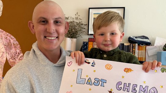 Nic Maddinson with his son August following his final treatment for testicular cancer.
